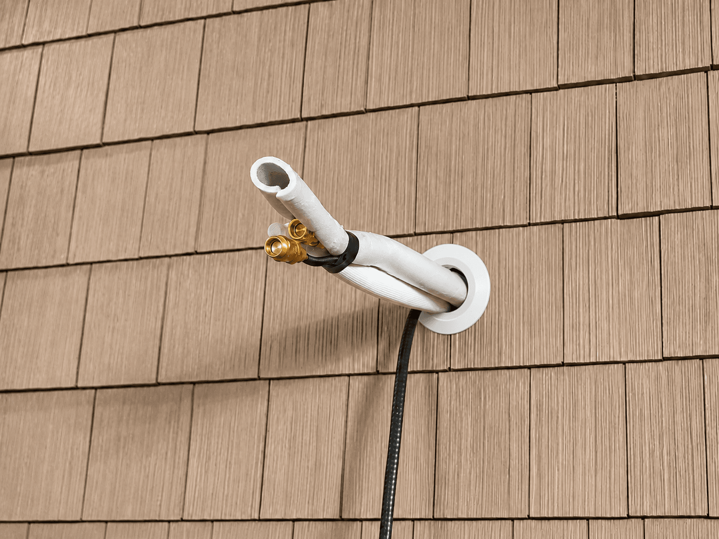 insulated line set showing the pipe insulation wrap and weatherproofing