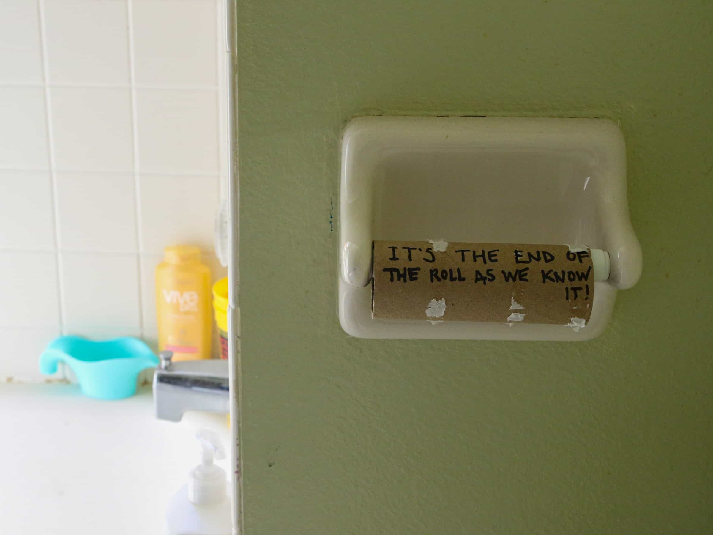 Empty toilet roll with writing