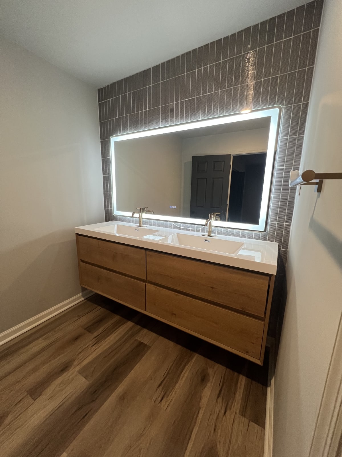 Refreshed bathroom with new vanity, modern mirror, and updated lighting after cosmetic remodel - Atlanta metro project 5