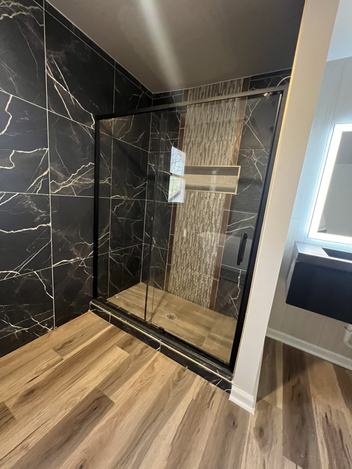 Fully remodeled bathroom with tile surround, ventilation upgrade, and frameless glass door - Atlanta metro project 6