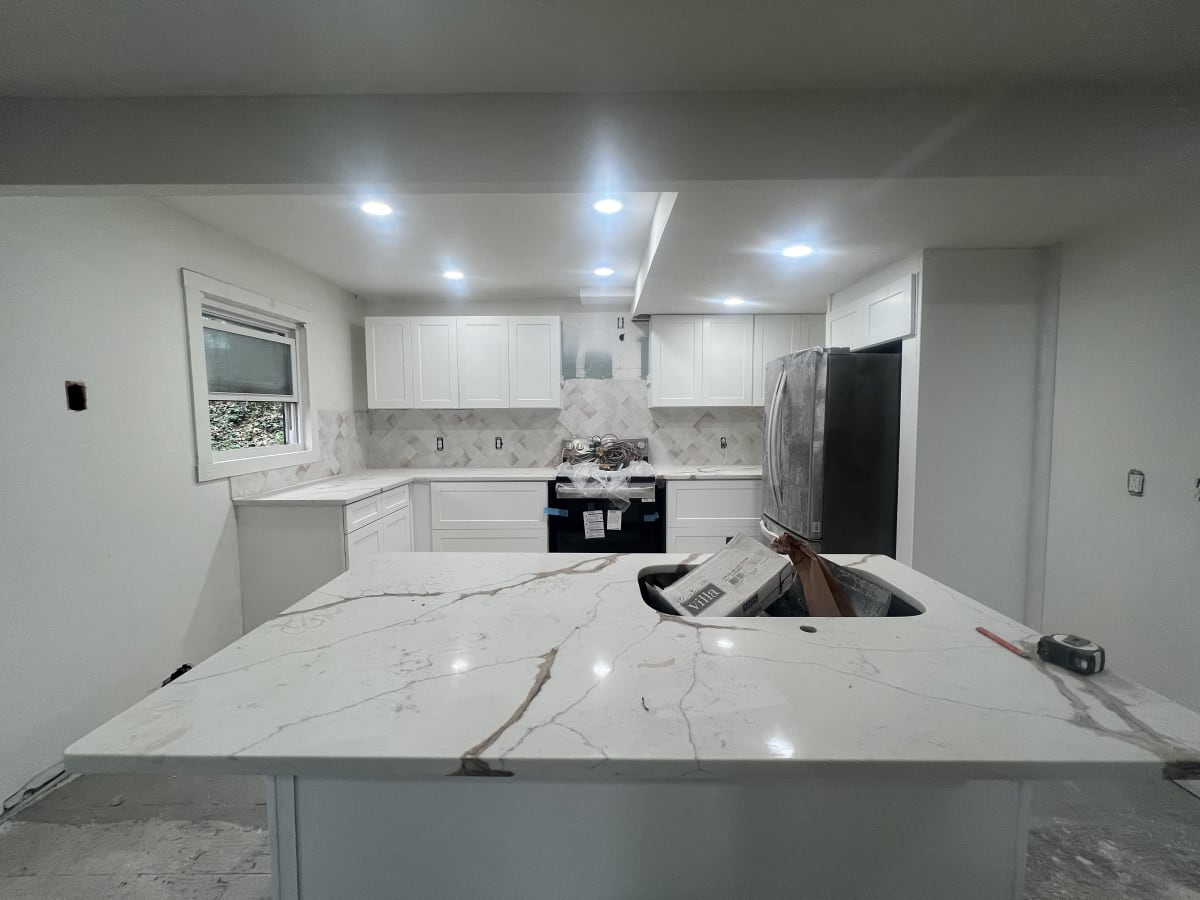 Bright modern kitchen with replacement cabinets and slab backsplash after remodel - Atlanta metro project 2
