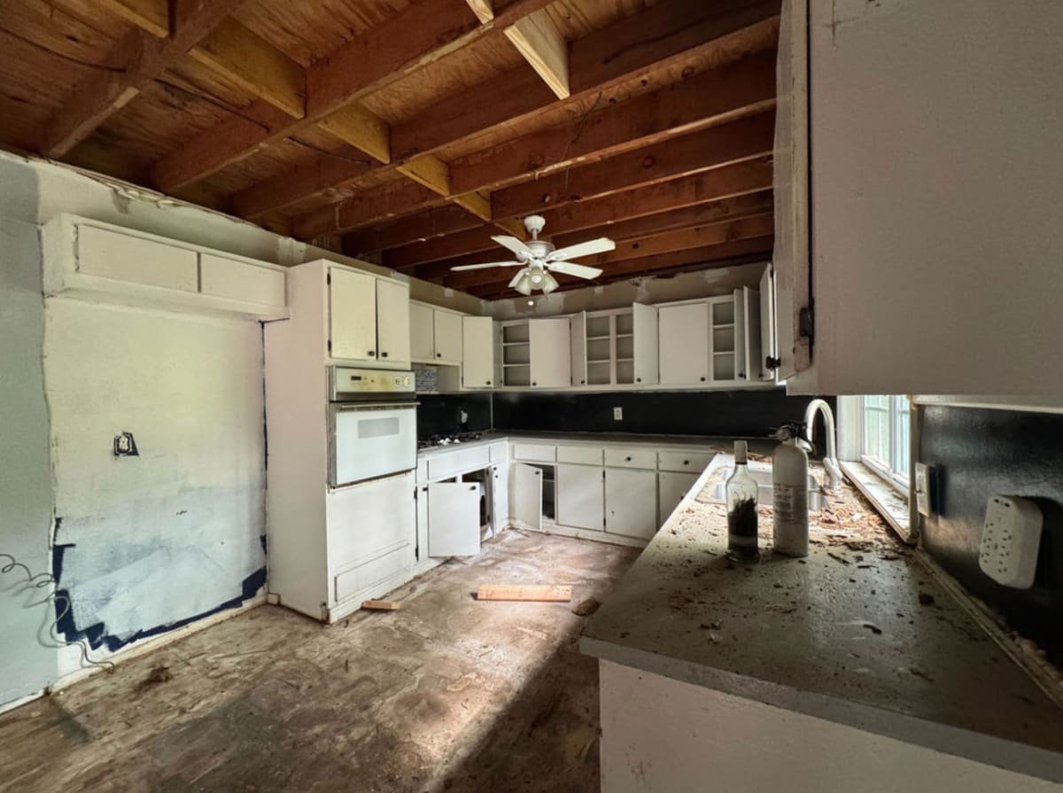 Cramped kitchen with dated hardware and countertops before renovation - Atlanta metro project 5