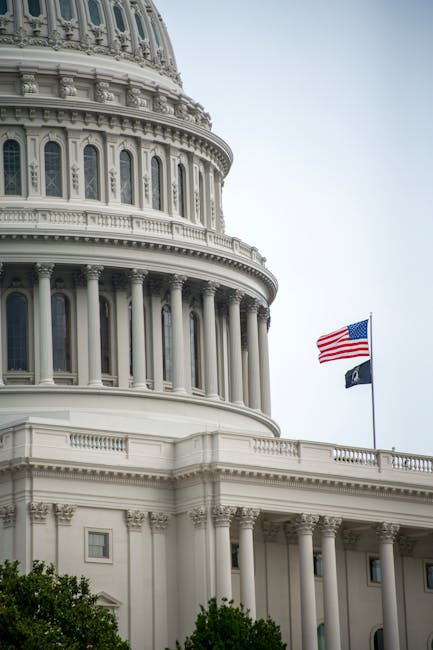 Close-up view of U.S. Capitol dome and American flag in Washington, D.C.