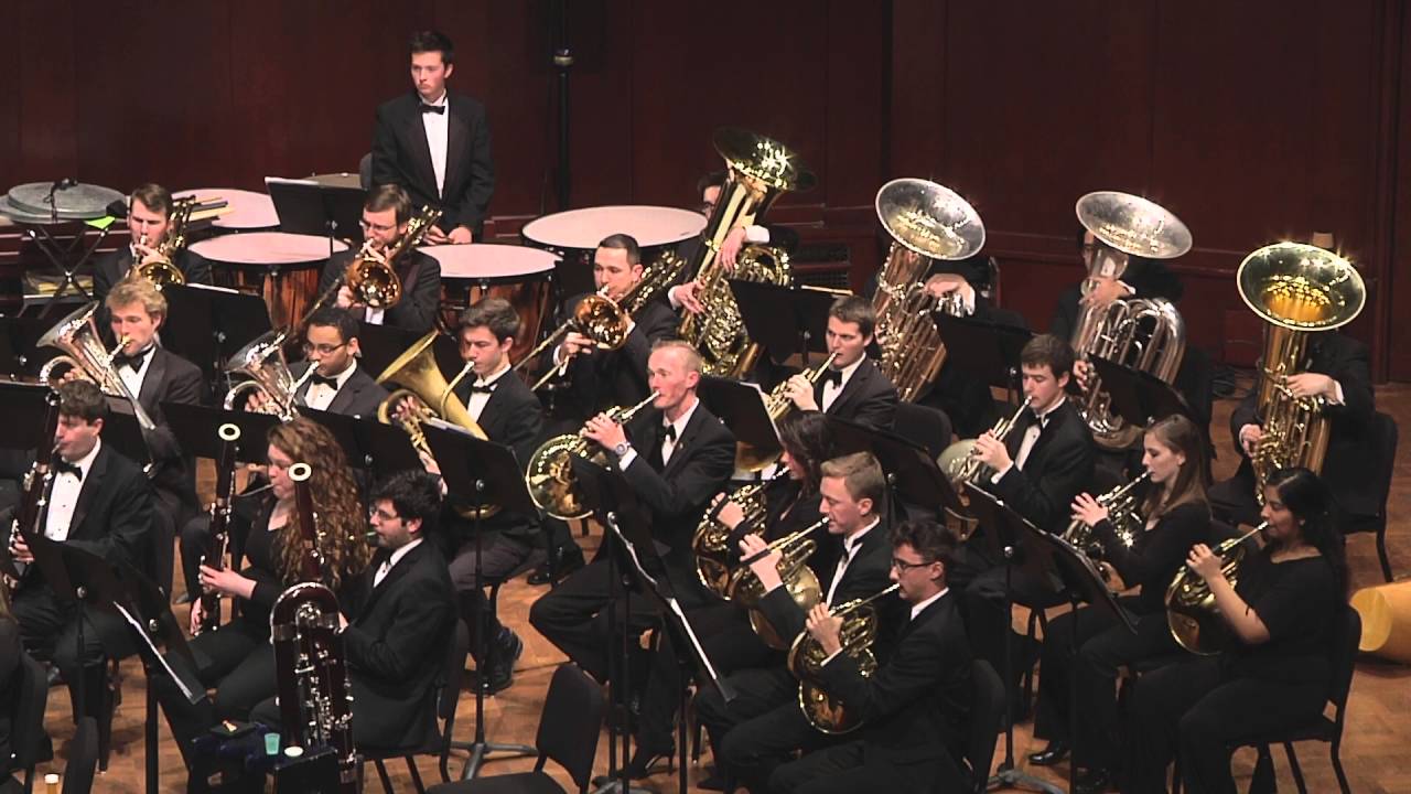 Large brass ensemble performing on stage