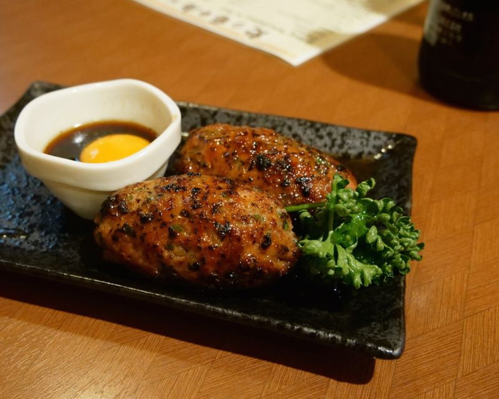 Washing down succulent yakitori skewers with cold local beer