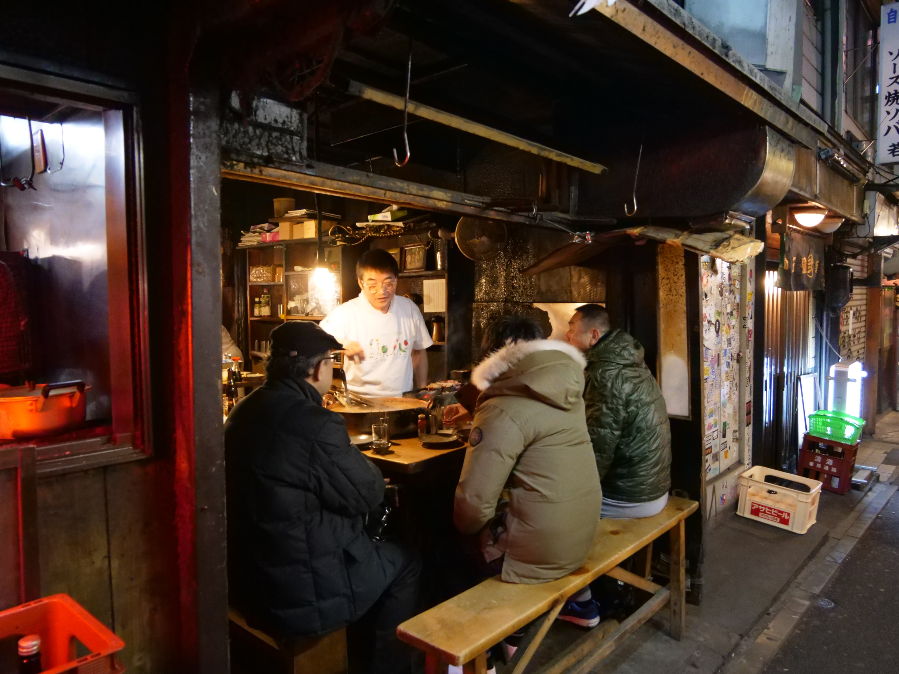 Locals drink in a izakaya after work 