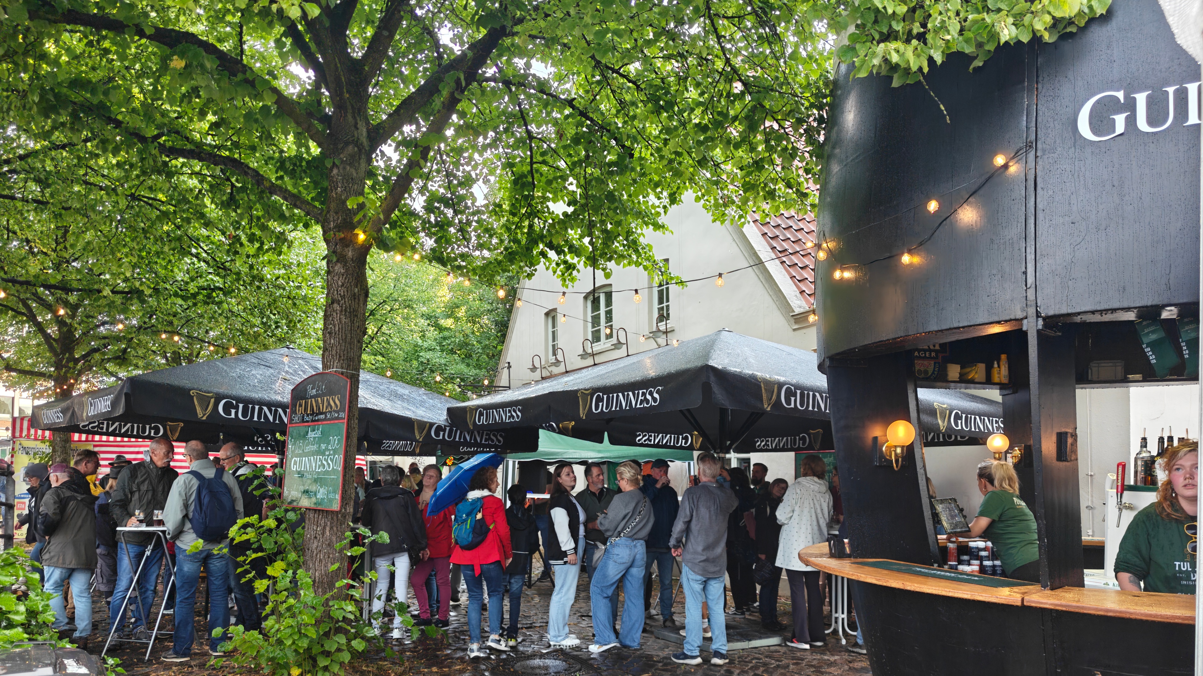 Guinness Glass Event Bar with Large Guinness Parasol Umbrellas Outdoors Maritime Festival Vegesack