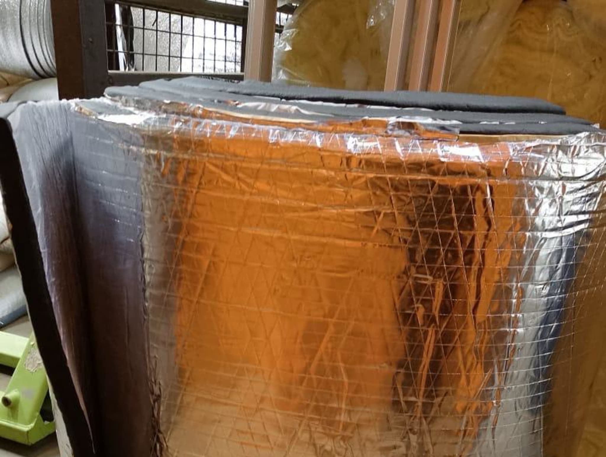 Aluminum foil insulation blanket roll, thermal insulation material, shown coiled for shipping