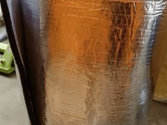 Aluminum foil insulation blanket roll, thermal insulation material, shown coiled for shipping