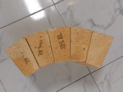 Insulating Fire Brick — lightweight alumina-silicate ceramic bricks arranged in a semi-circle