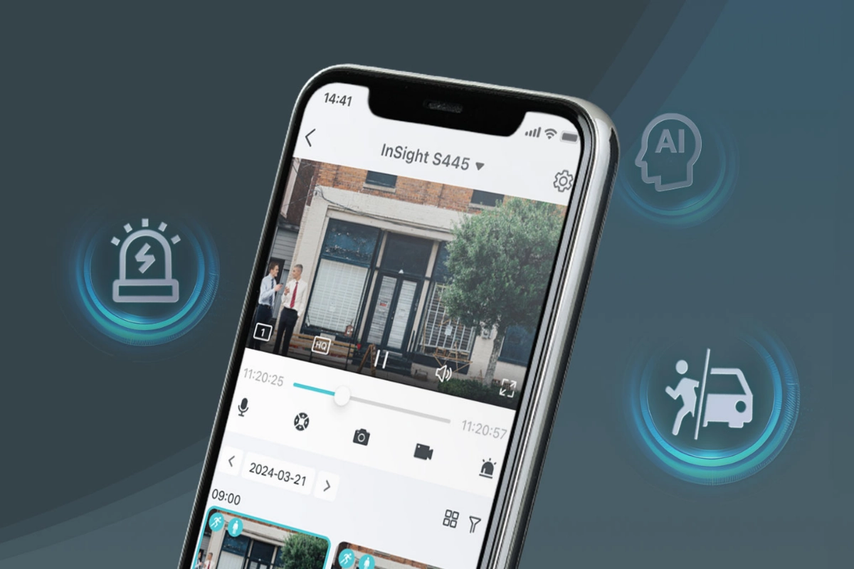 A smartphone displaying a security camera feed with a building's facade and pedestrians. Icons for alerts, AI, and vehicle detection surround the phone.