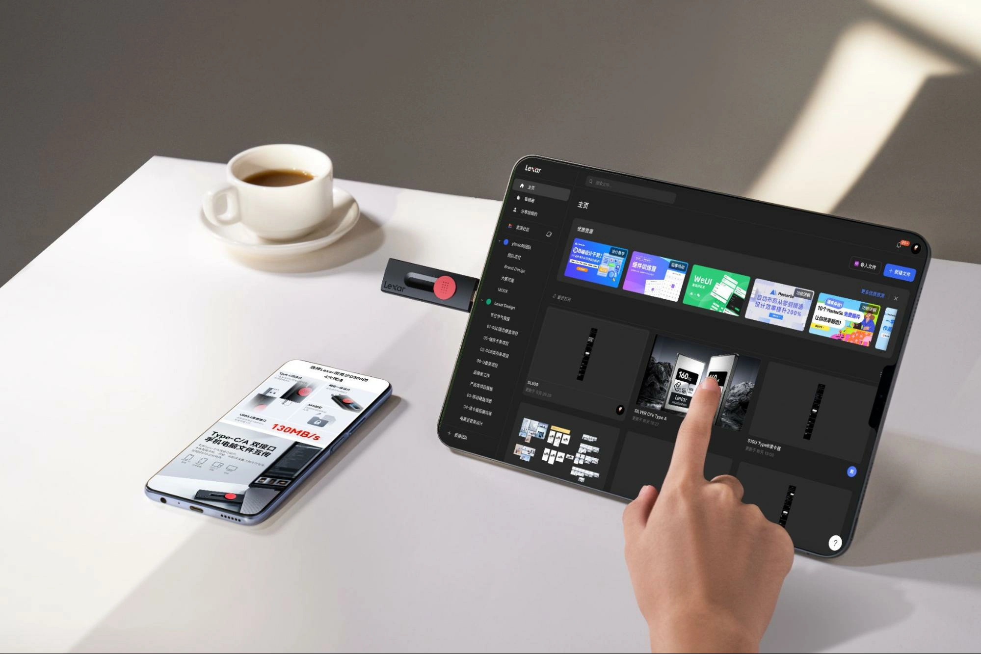 A Lexar USB-C drive connected to a tablet and a smartphone showing high-speed data transfer of 130MB/s, next to a cup of coffee.