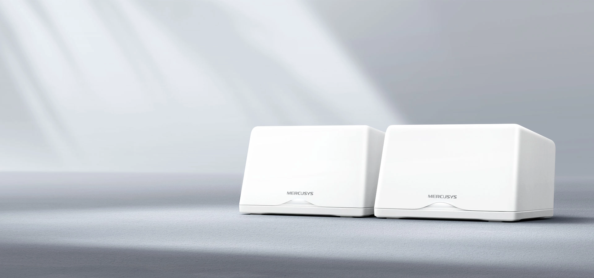 Two white rectangular Wi-Fi routers labeled "Mercusys" sit on a smooth surface, with soft, diffused light creating a serene, modern ambiance.
