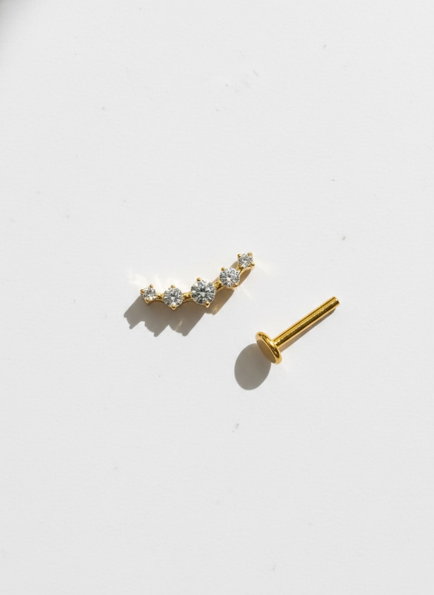 Piercing labret titanio 16G, 5 zirconias mini, doraado