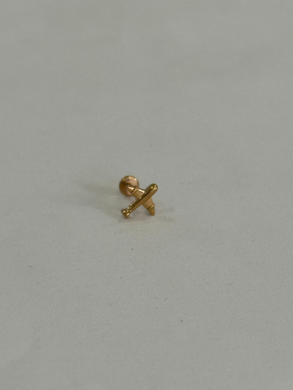 Avión dorado. Piercing de acero quirúrgico grado implante 316L