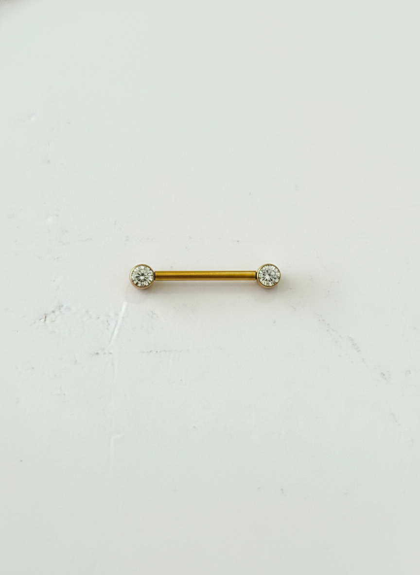 Piercing pezon titanio 14G, zirconias encapsuladas.