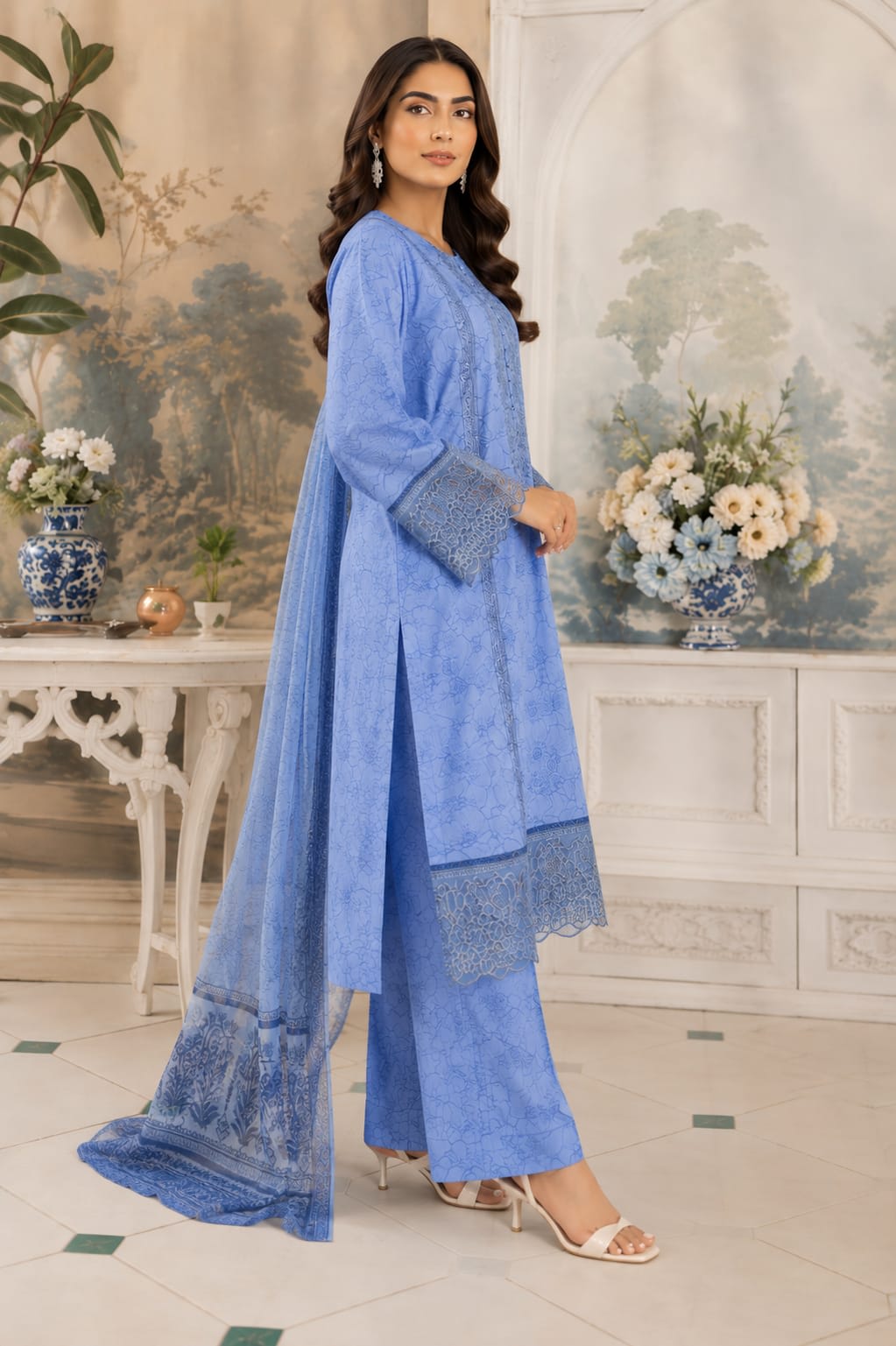 Full length back view of a mint green floral lawn kameez and straight trousers showing the fabric distribution