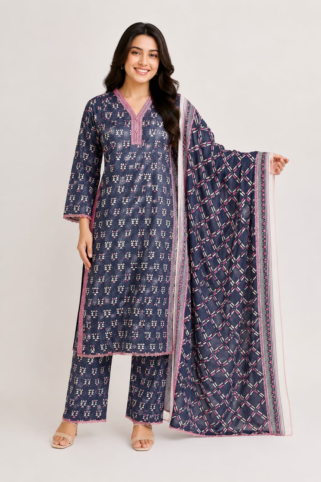 Full length front view of a model wearing a monochromatic black and white printed floral 3-piece lawn suit with a matching dupatta