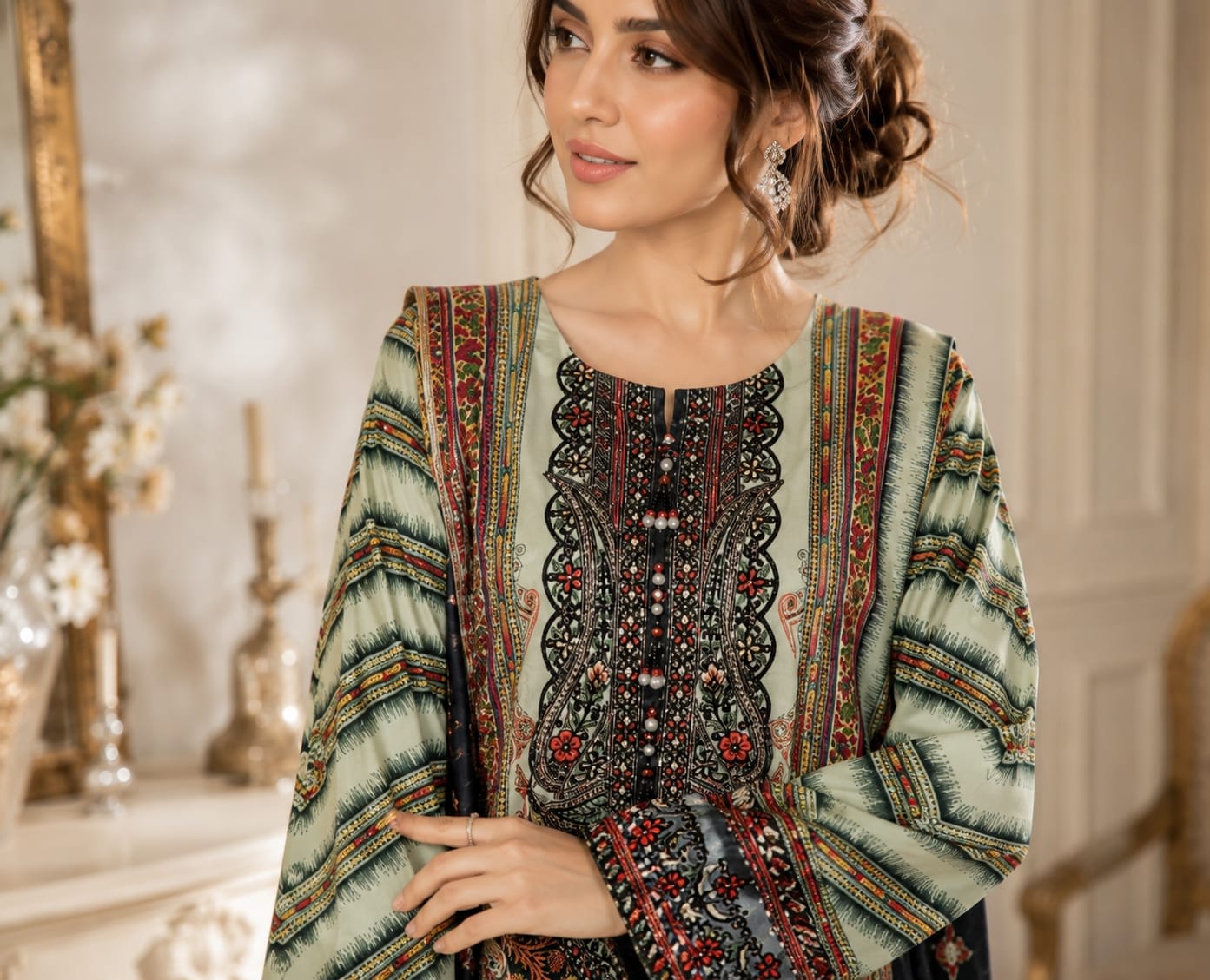 Full length back view of an emerald green floral lawn kameez and straight trousers showing the print layout