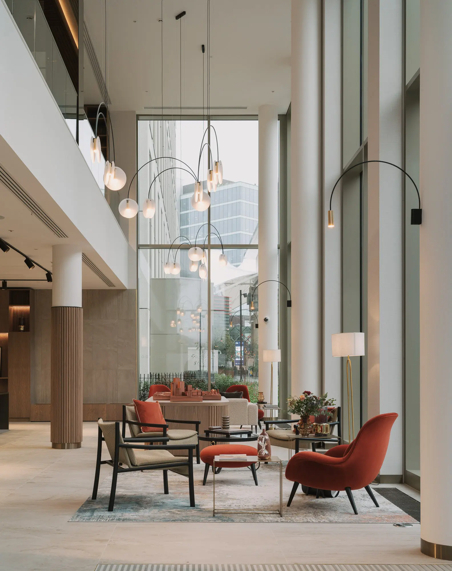 Thumbnail Elegant double-height lobby at Coppermaker Square with modern seating and statement lighting
