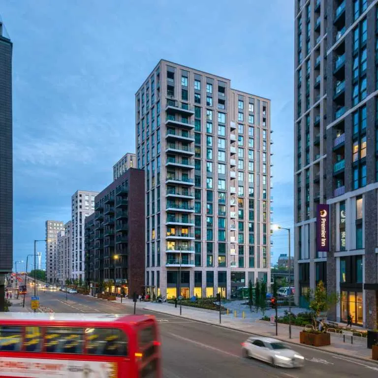Exterior view of Fizzy East16 residential building in Canning Town at dusk
