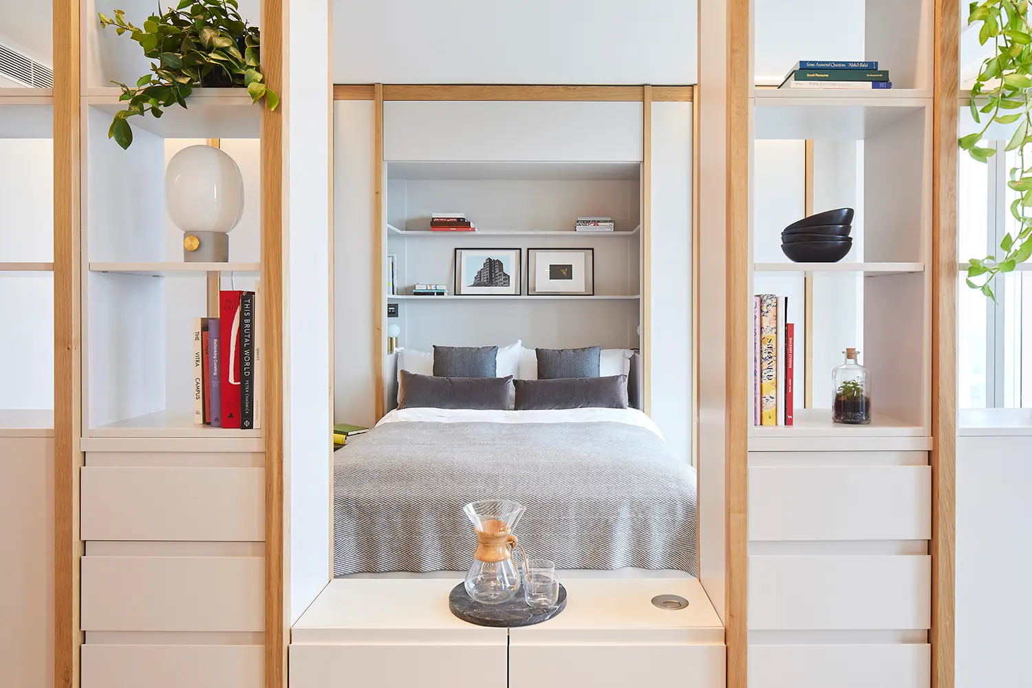 Thumbnail Bedroom in a Manhattan Loft Gardens apartment with built-in shelving and minimalist decor