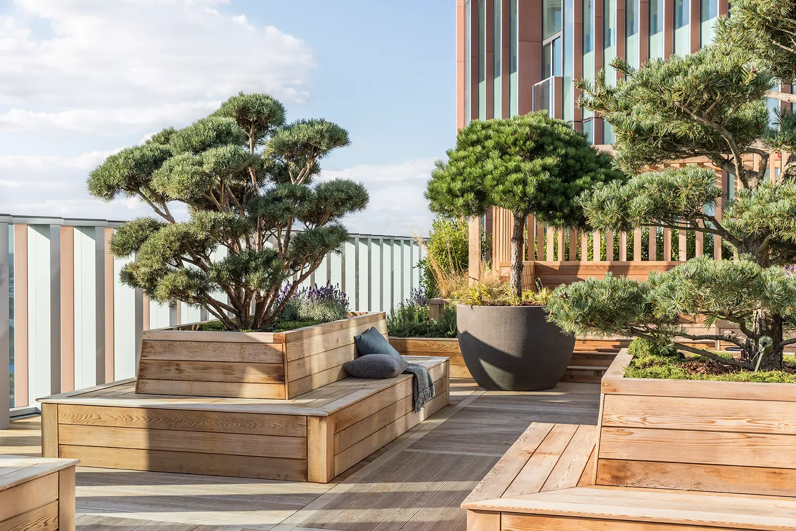 Thumbnail Sky garden terrace at Manhattan Loft Gardens with wooden seating and sculpted trees