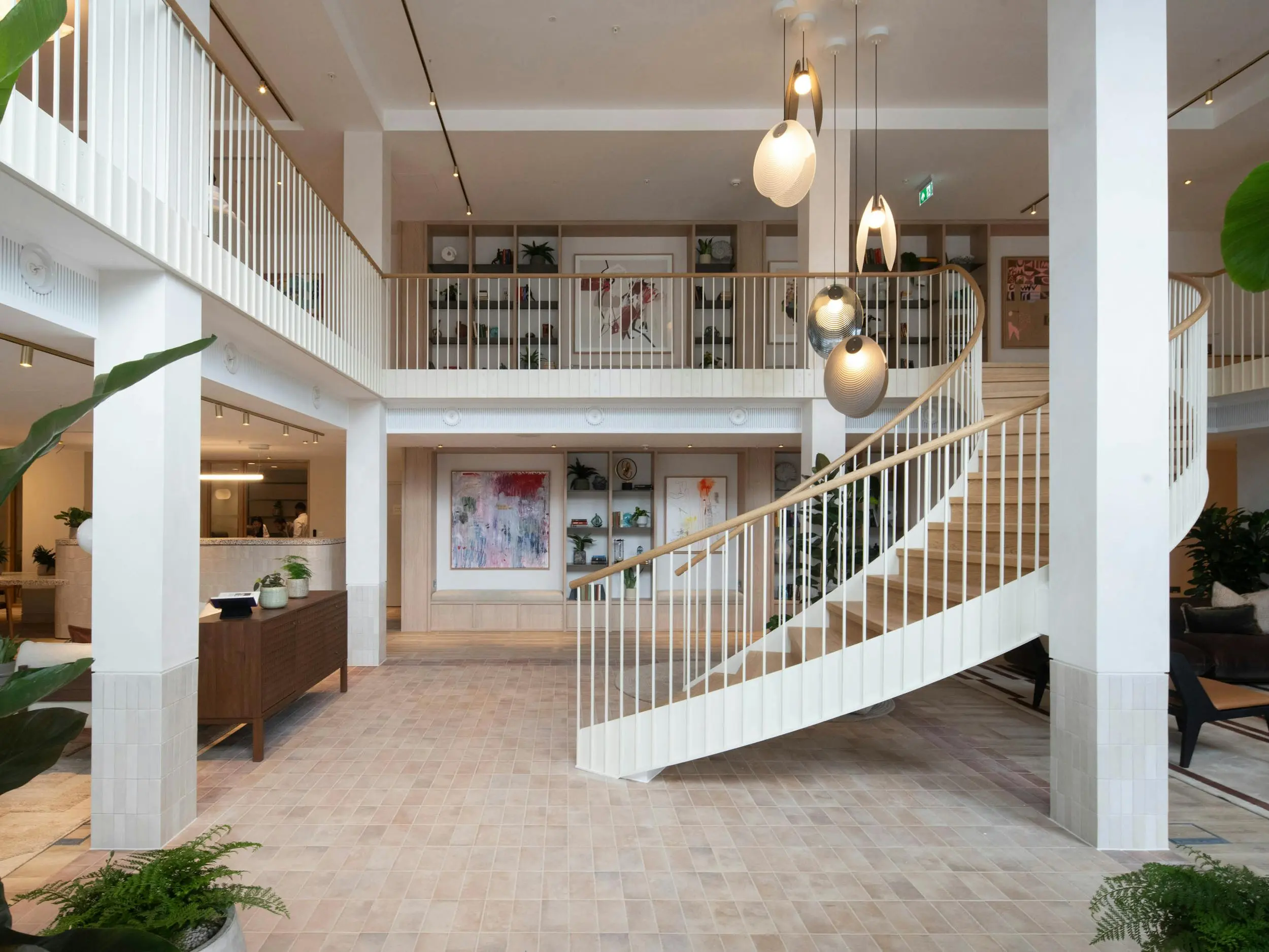 Thumbnail Elegant lobby at Momento Hayes featuring a curved staircase and concierge area