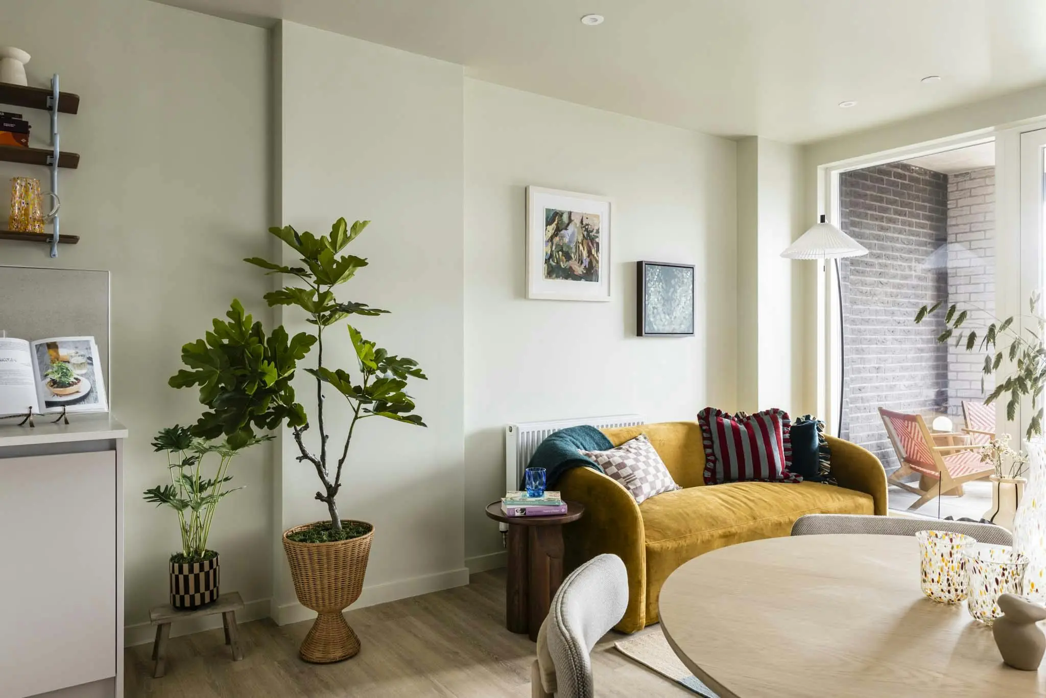 Thumbnail Stylish living area at Momento Hayes with modern decor and balcony access