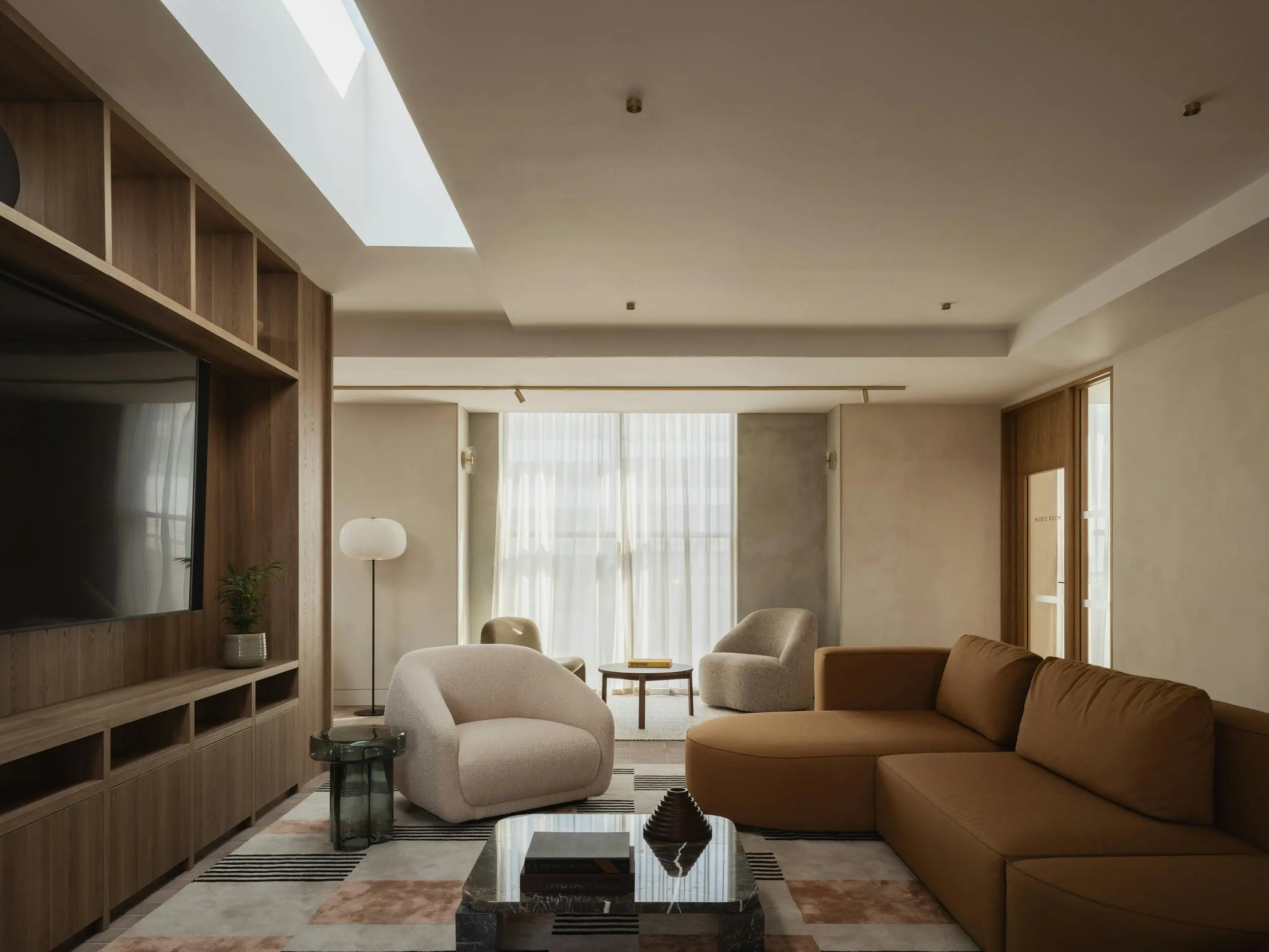 Thumbnail Resident screening room at Momento Hayes with modern seating and large TV