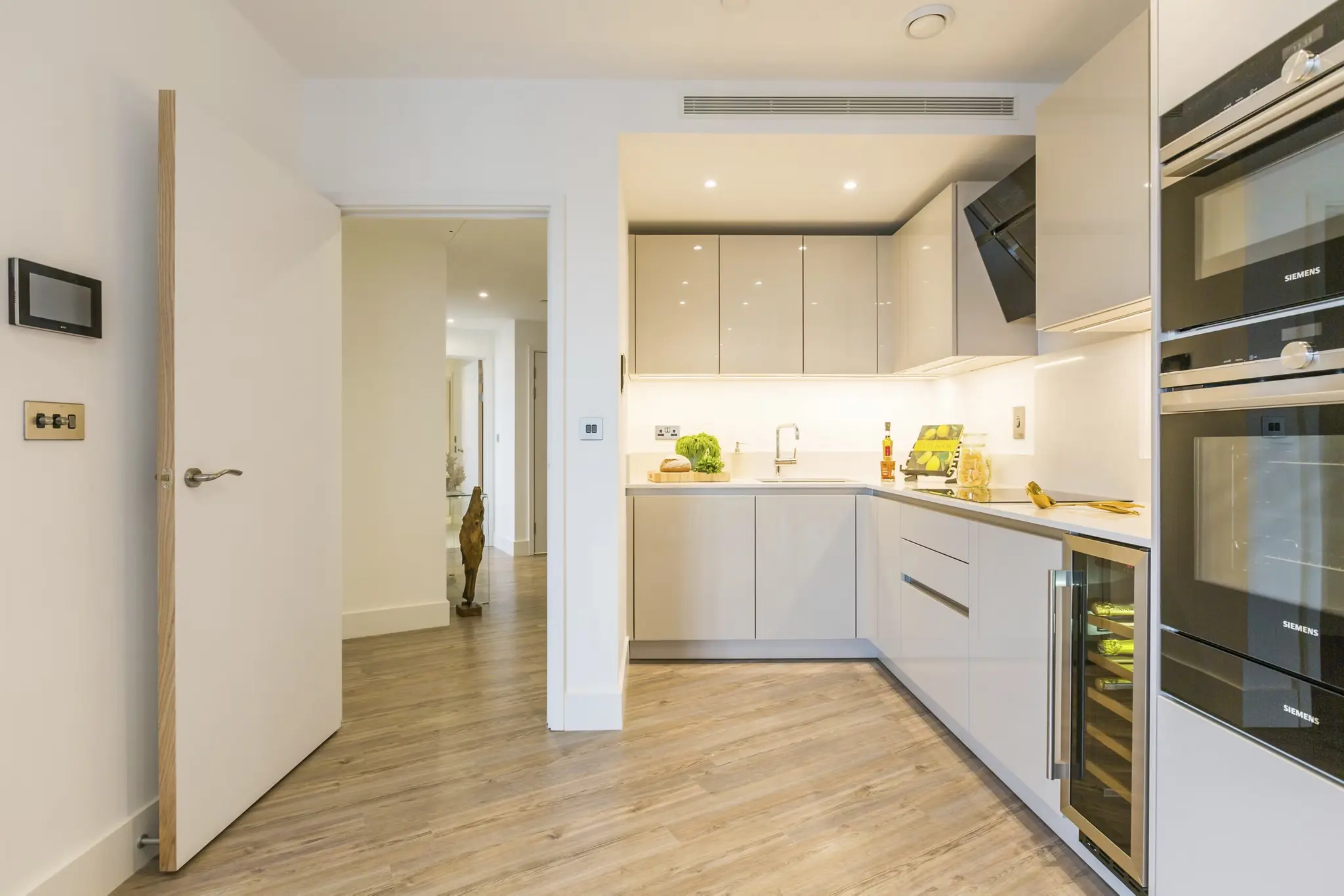 Thumbnail Sleek kitchen at MyLo Aldgate Place with integrated appliances and glossy cabinets