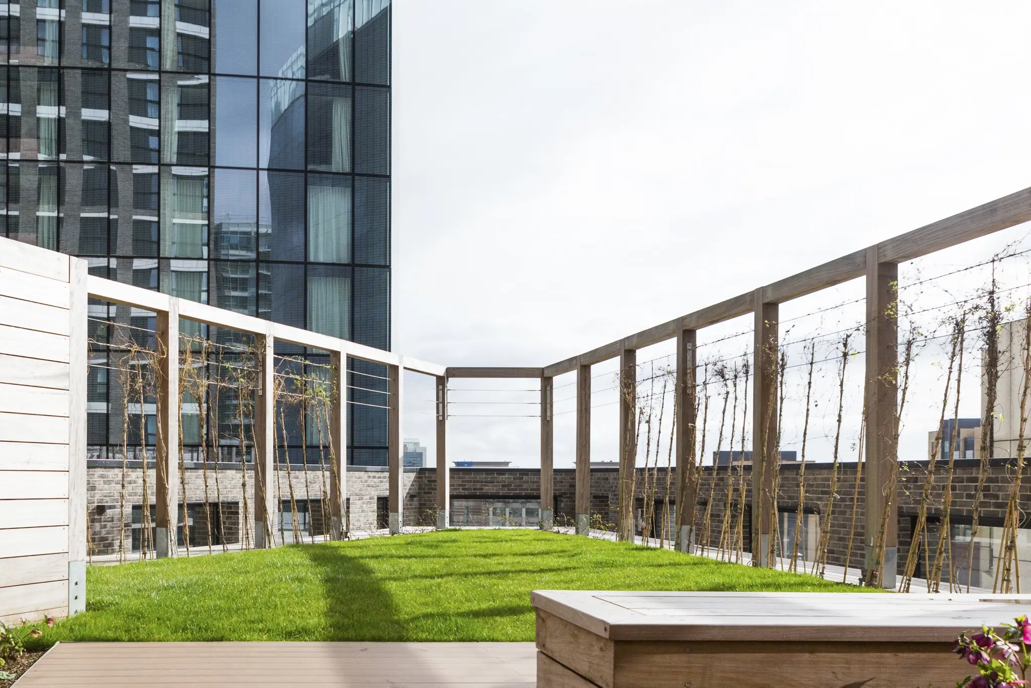 Thumbnail Rooftop garden at MyLo Aldgate Place with wooden seating and city views