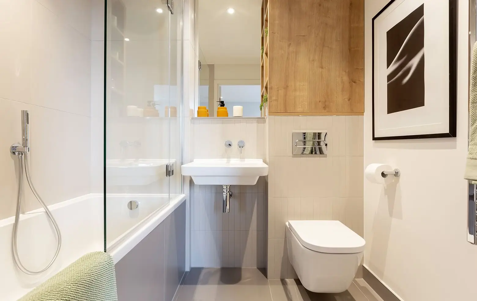 Thumbnail Contemporary bathroom at Ten Degrees with bathtub, wall-mounted sink, and wooden storage accents