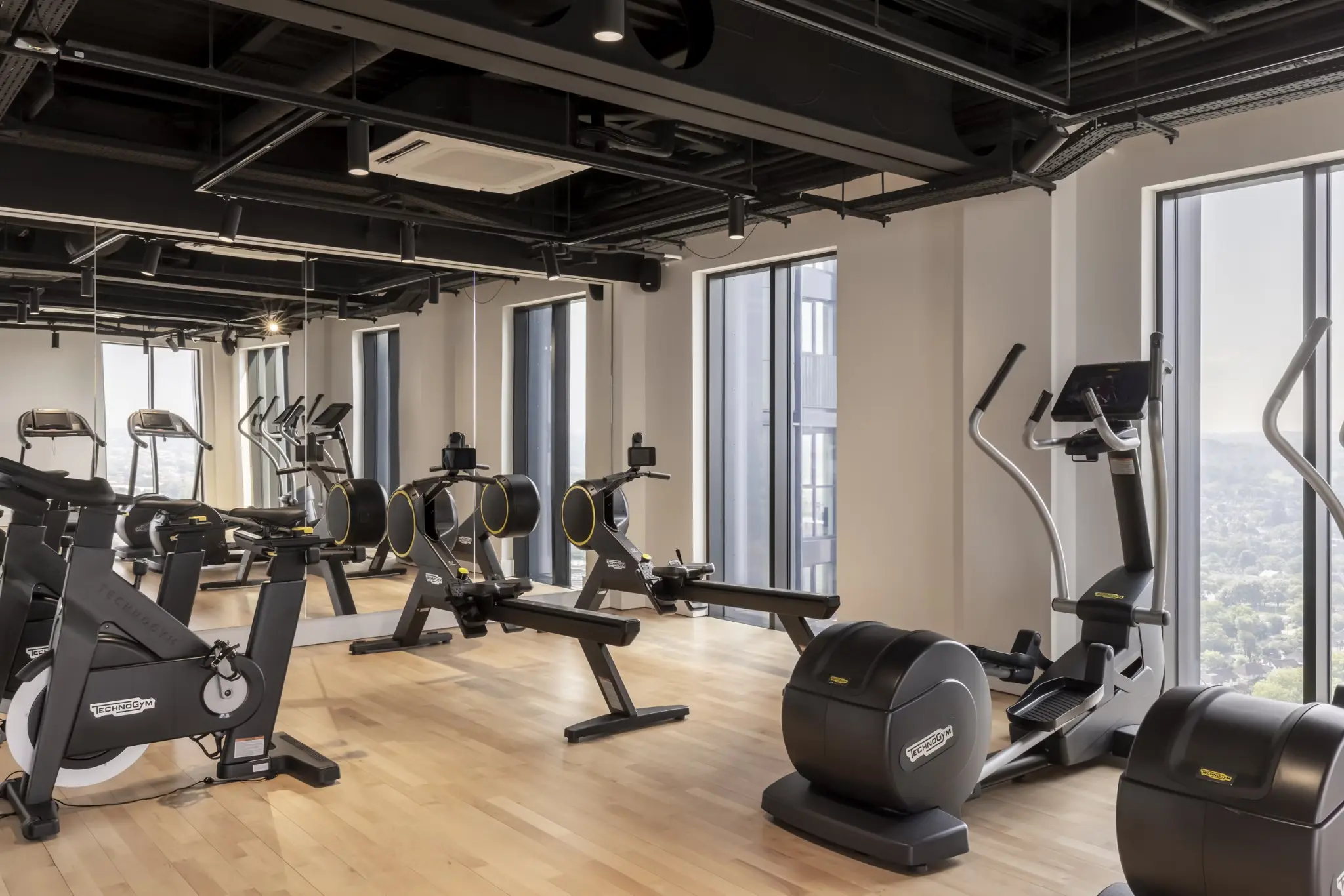 Thumbnail Ten Degrees gym with Technogym equipment, mirrored walls, and floor-to-ceiling windows