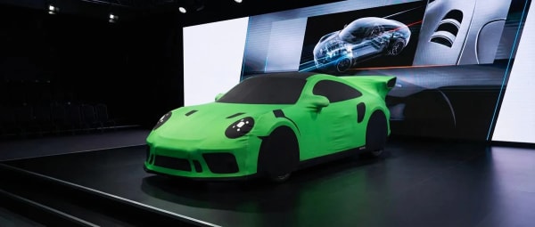Porsche GT3 RS green cover on showroom stage