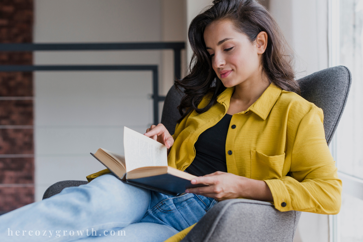 Woman reading one of the books that feel like therapy in a cozy corner