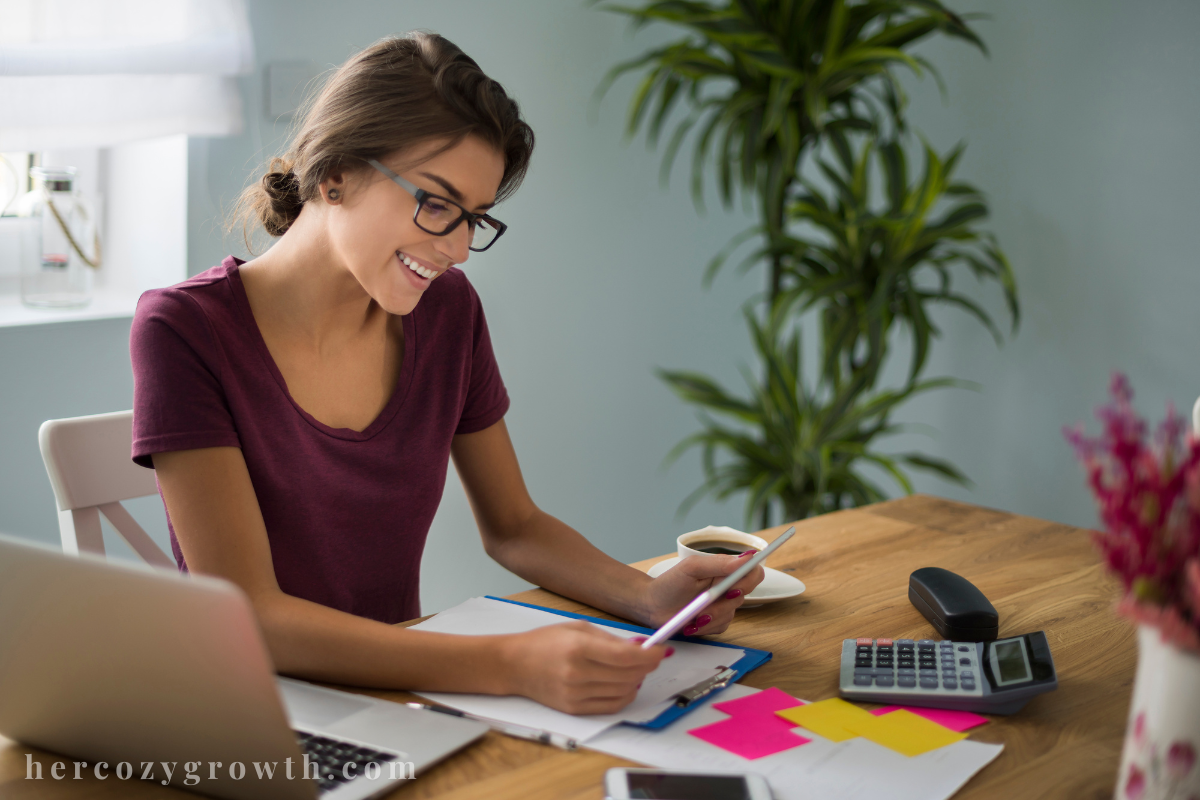 Woman reading money mindset books for women and planning her finances