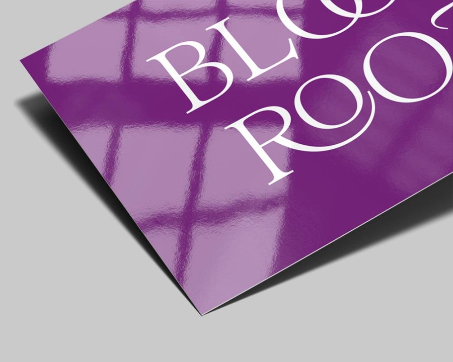 Close-up of glossy business card finish showing reflective sheen and vivid color reproduction