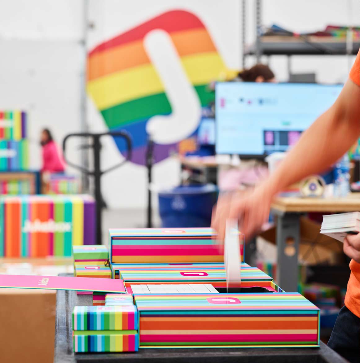 Quality control inspection at Jukebox Print. Every business card is reviewed by hand before shipping.