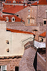 color photograph of stone buildings, rooftops white walls and geometric shapes