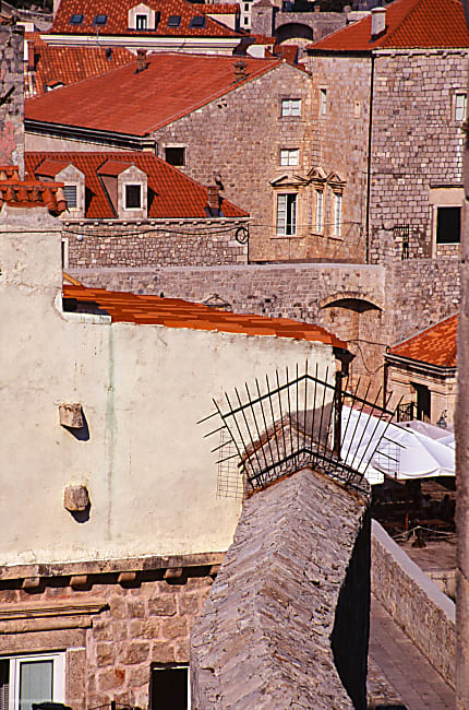 color photograph of stone buildings, rooftops white walls and geometric shapes