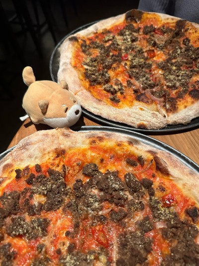 Deciding which pizza to eat at Baia