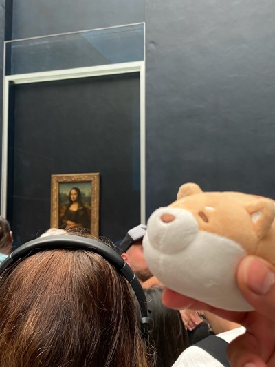 Checking out Mona Lisa at the Louvre