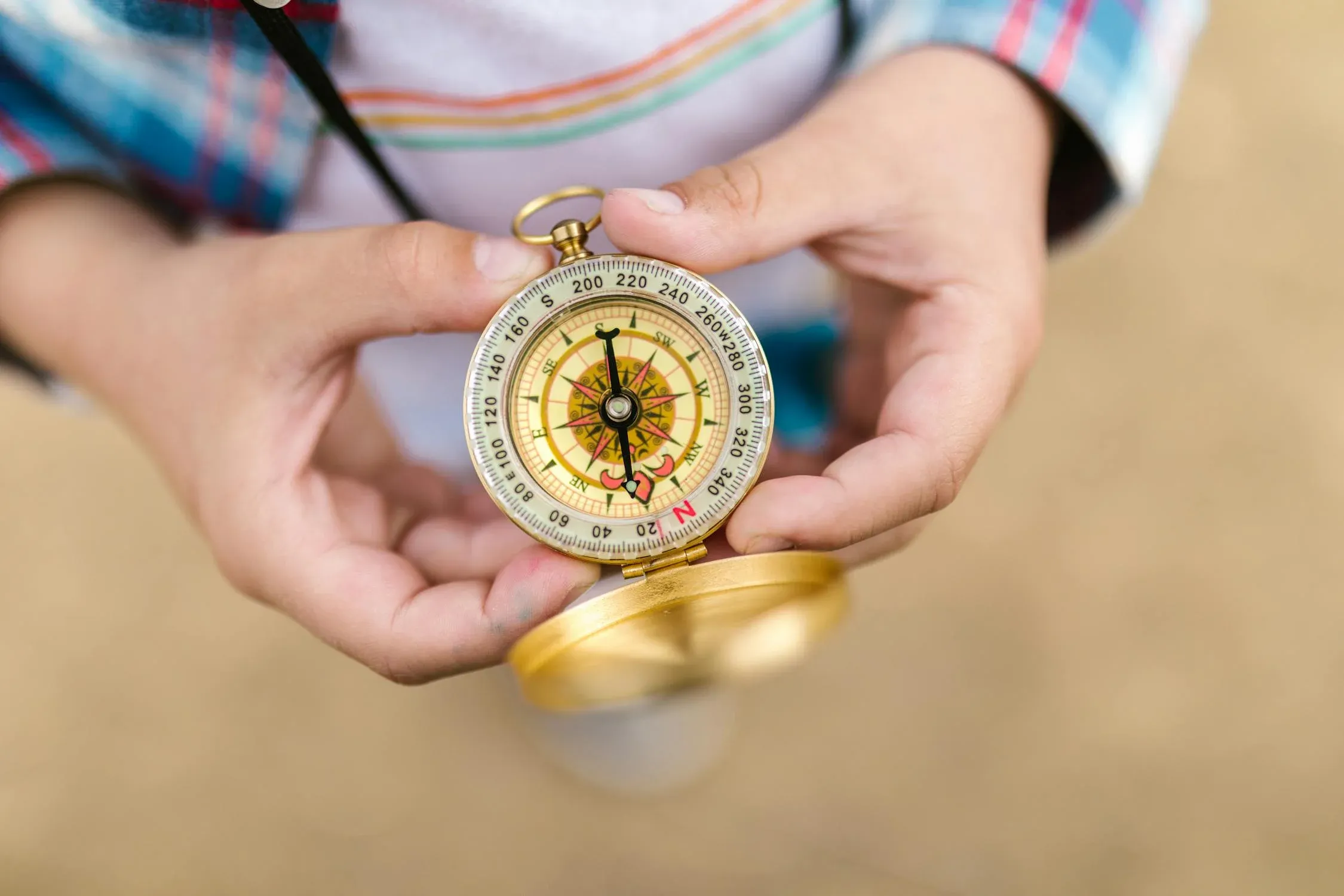 person holding a compass