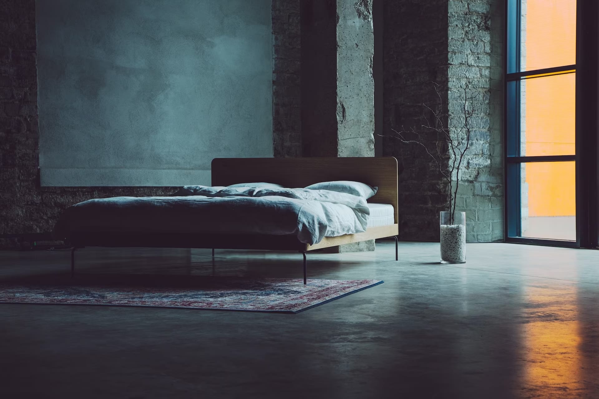 A bed in a room with a window