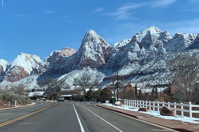 Snow-dusted Zion peaks above the main road through Springdale in winter