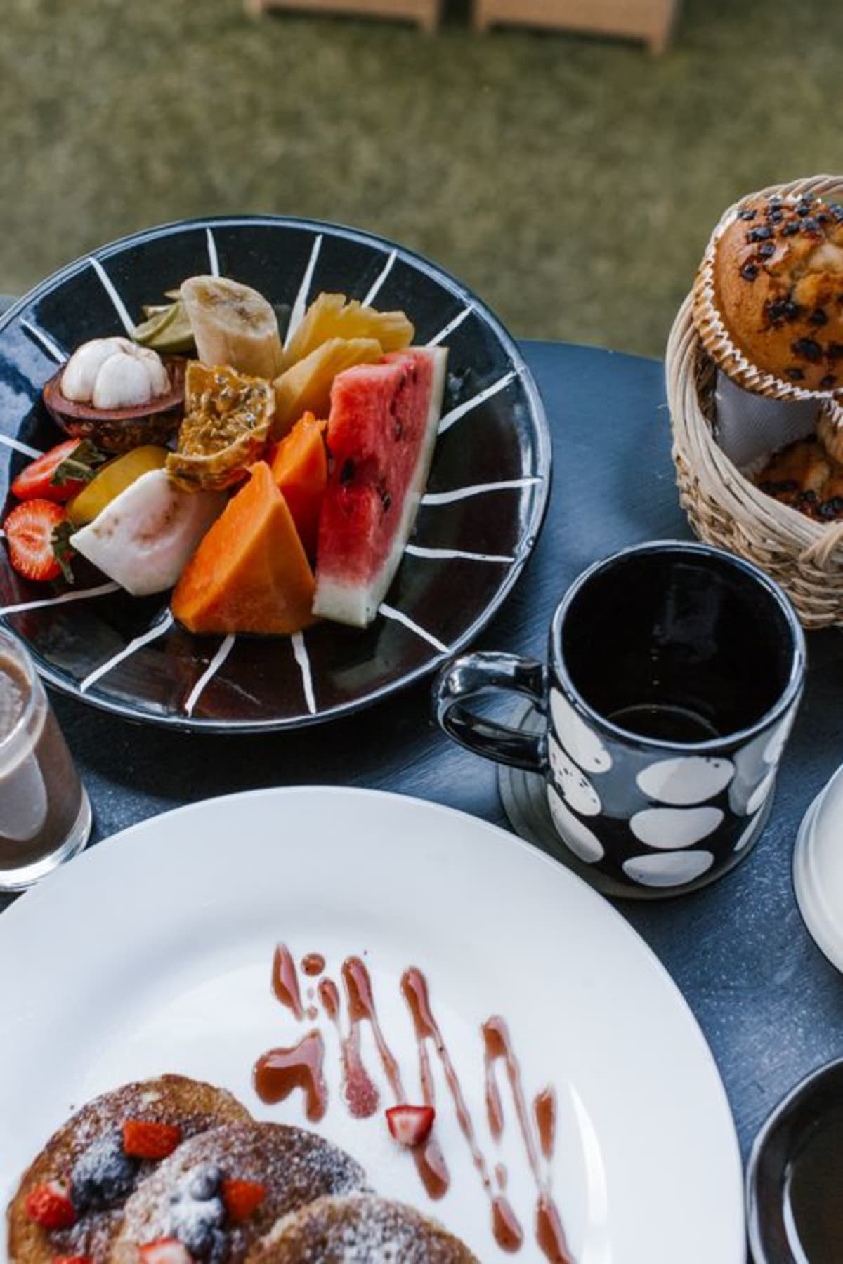 Fresh tropical fruit and pancakes brunch spread typical of La Punta cafes in Puerto Escondido