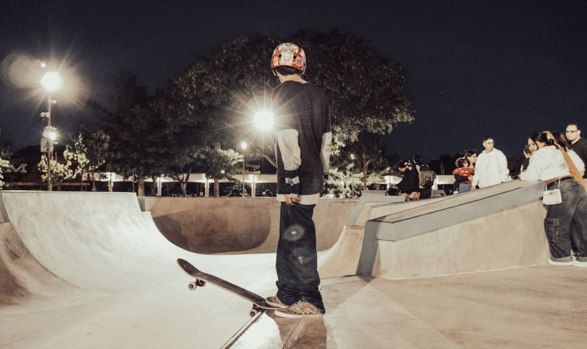 Skateboarder at the edge of a ramp at night, the evening vibe at The Boneyard in La Punta