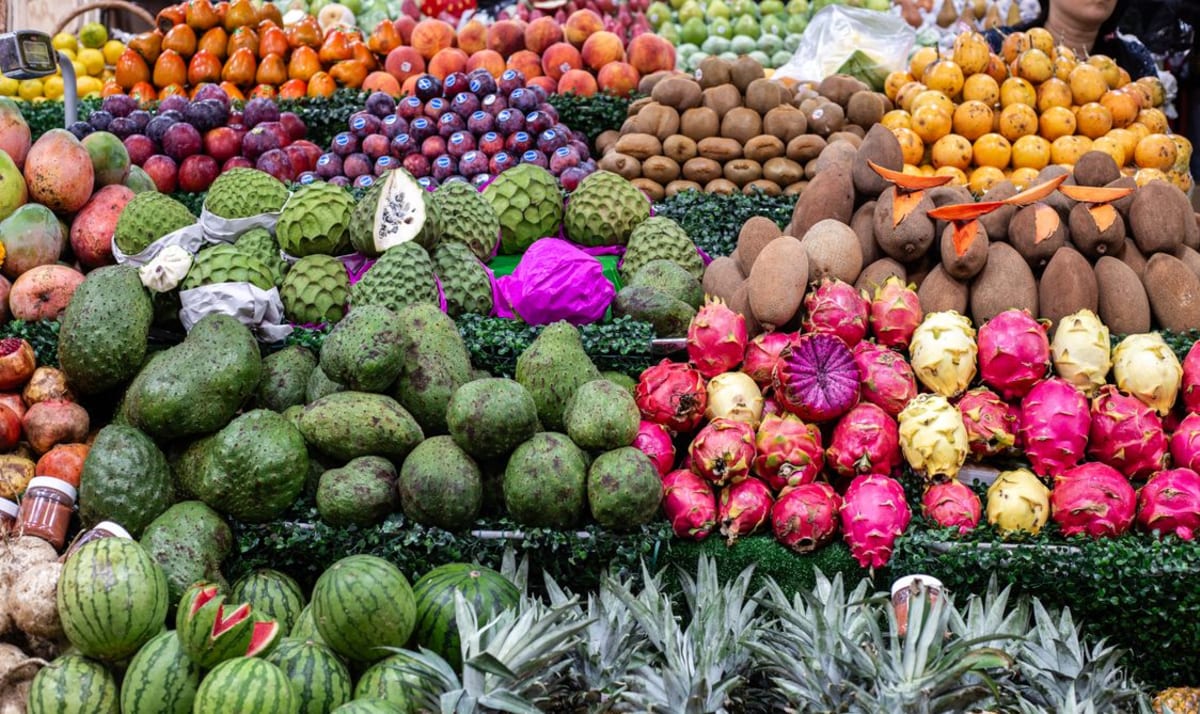 Tropical fruit stacked at a Mexican market, part of the weekly shopping routine of a winter stay