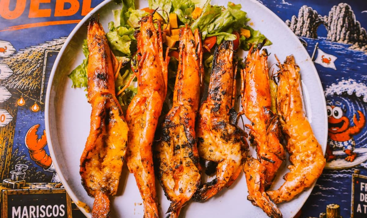 Grilled seafood skewers served at a beachfront restaurant, a San Agustinillo specialty